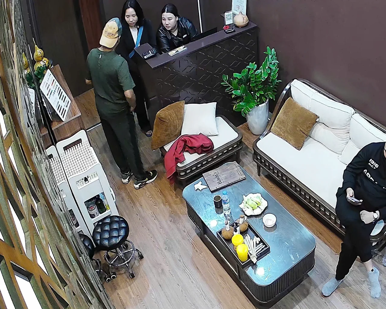 The reception area of Rosie's Magical Spa with staff assisting a customer