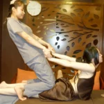 Therapist performing traditional Thai assisted stretch on a client – Massage Spa Hanoi.