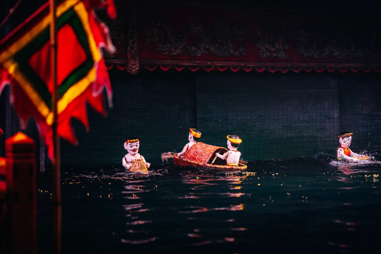 Hanoi water puppetry scene with dragon and boat performers